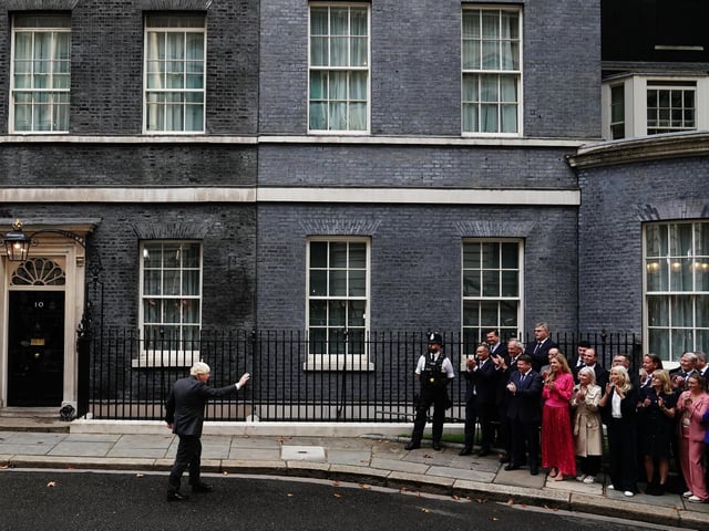 Outgoing Prime Minister Boris Johnson makes a speech outside 10 Downing Street, London, before leaving for Balmoral for an audience with Queen Elizabeth II to formally resign as Prime Minister. Here he waves to those gathered outside.