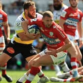 Finn Russell of Racing 92 is tackled by La Rochelle's Tawara Kerr-Barlow during the Heineken Champions Cup semi-final. (Photo by David Rogers/Getty Images)