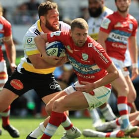 Finn Russell of Racing 92 is tackled by La Rochelle's Tawara Kerr-Barlow during the Heineken Champions Cup semi-final. (Photo by David Rogers/Getty Images)