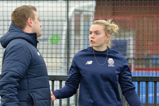 Chris Duncan chatting to goalkeeper Jessica Buchanan at Peffermill Playing Fields before flying to Chile