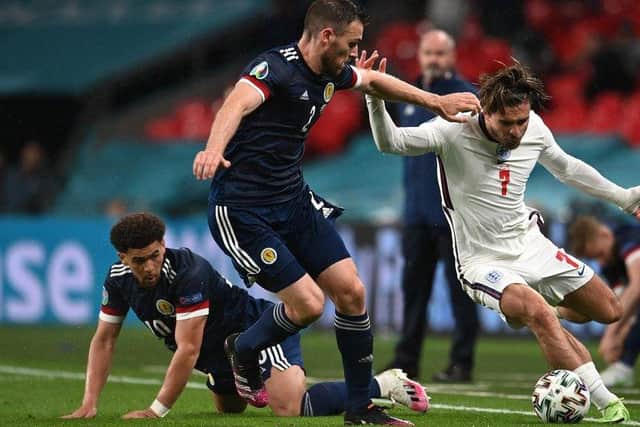 Jack Grealish of England runs with the ball whilst under pressure from Stephen O'Donnell and Che Adams of Scotland during the UEFA Euro 2020 Championship Group D match between England and Scotland at Wembley Stadium on June 18 picture: Andy Rain/Getty Images