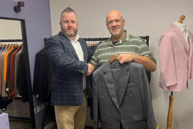 Generous: Chris McGowan (left) with Graham Forbes of Grassroots Clothing.