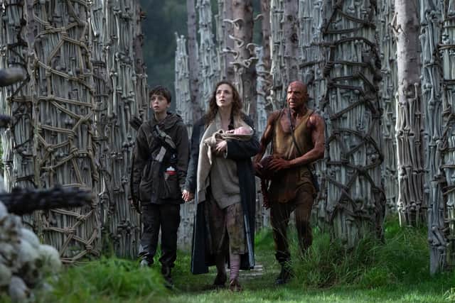 Spike (Alfie Williams), Isla (Jodie Comer) and Dr. Kelson (Ralph Fiennes) in 28 Years Later