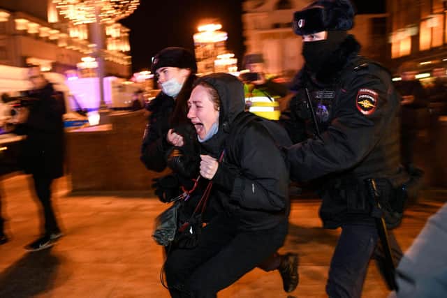 Police officers detain a demonstrator in Moscow during a protest against Russia's invasion of Ukraine (Picture: Alexander Nemenov/AFP via Getty Images)