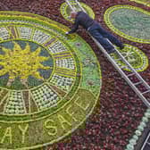 David Dorward, Head gardener for Edinburgh City Council puts the final touches to Princes Street Gardens Floral Clock. Paying tribute to Key Workers and the NHS. June 15 2020