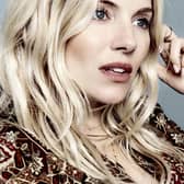 Sienna Miller wearing a piece from her M&S collection