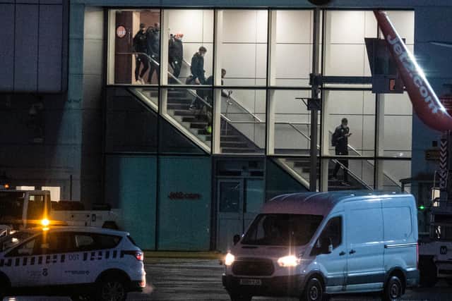 Celtic's players arrive back from Dubai at Glasgow Airport on Friday. (Photo by Ross MacDonald/SNS Group).