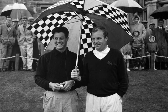 Gordon Cosh and Ronnie Shade taking shelter at St Andrews in July 1965.