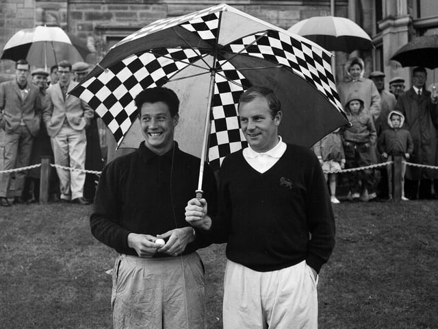 Gordon Cosh and Ronnie Shade taking shelter at St Andrews in July 1965.