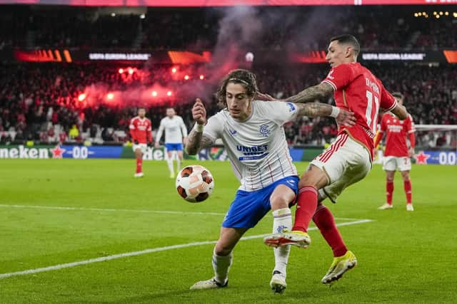 Benfica's Angel Di Maria, right, and Rangers' Fabio Silva vie for the ball at the Estadio da Luz.