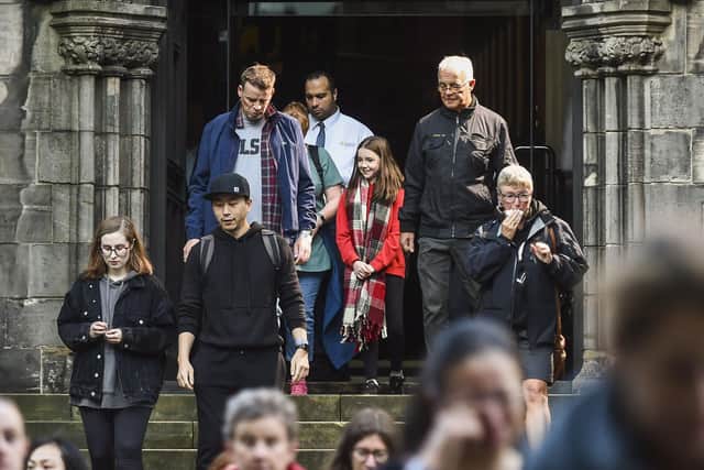 Members of the public leave St Giles' Cathedral after paying their respects to Queen Elizabeth II. Picture: Lisa Ferguson