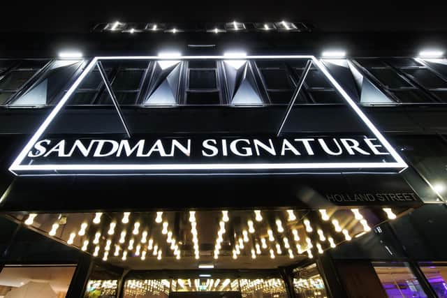 The Sandman Signature Hotel Glasgow lights up the night sky. Pic: Steve Welsh
