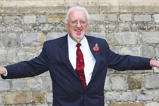Bernard Cribbins poses with his Officer of the British Empire (OBE) medal after receiving it during an Investiture ceremony with the Princess Anne at Windsor Castle in 2011.