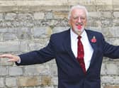 Bernard Cribbins poses with his Officer of the British Empire (OBE) medal after receiving it during an Investiture ceremony with the Princess Anne at Windsor Castle in 2011.