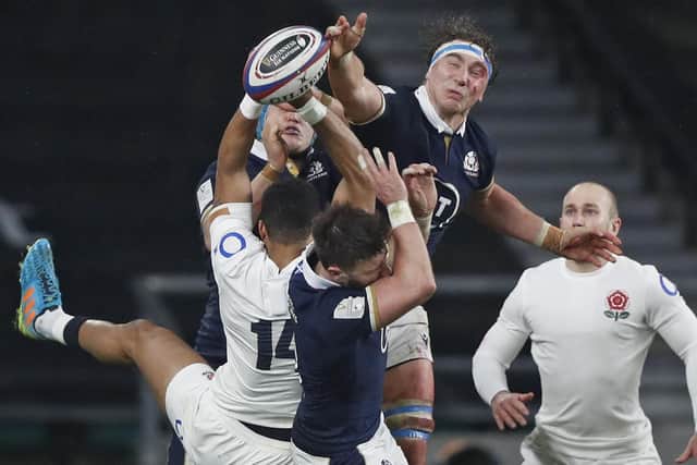 Scotland's Jamie Ritchie, top right, reaches for a loose ball in the win over England. Picture: Alastair Grant/AP