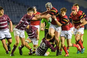 Stewart Melville’s Mikey Jones, now a pro with Edinburgh Rugby, is tackled during the Boys School Under 18 Cup Final against George Watson's College in December 2019. (Photo by Paul Devlin / SNS Group / SRU)