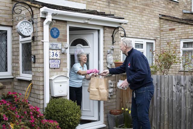Volunteers, such as people who delivered food parcels to elderly people during the Covid pandemic, benefit from the knowledge they are making a difference in the world (Picture: Dan Kitwood/Getty Images)