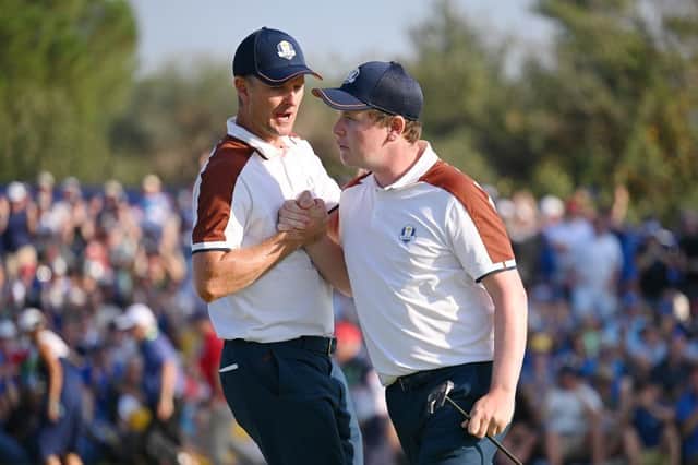 Justin Rose and Robert MacIntyre of Team Europe celebrate after the Scot holed a key birdie putt on the 13th green during the Saturday afternoon fourball matches in the 44th Ryder Cup at Marco Simone Golf & Country Club in Rome. Picture: Ross Kinnaird/Getty Images.