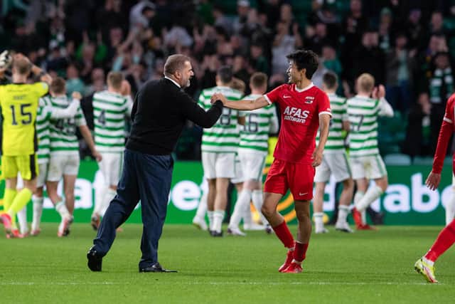 Celtic manager Ange Postecoglou acknowledges AZ's Yukianri Sugawara at full time following his team's 2-0 Europa League play-off victory. (Photo by Ross Parker / SNS Group)