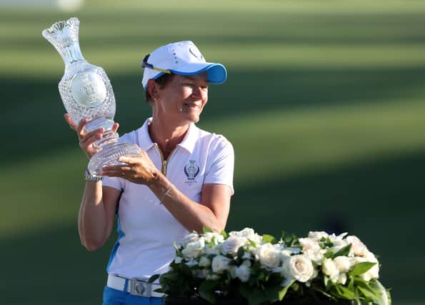 Catriona Matthew holds the Solheim Cup after leading Team Europe to glory in Ohio.