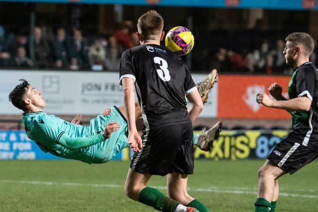 Dundee United's Jamie McGrath scores an overhead kick to make it 2-0 against Stirling University.