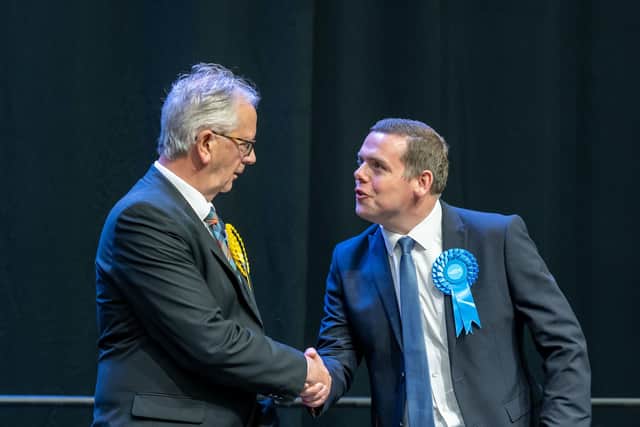Scottish Conservative Douglas Ross only narrowly lost out to the SNP's Seamus Logan (left) in Aberdeenshire North and Moray East (Picture: Michal Wachucik/PA)