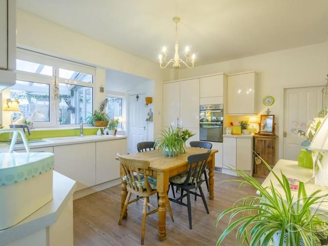 Let's begin our tour of the Alexandra Avenue property in the kitchen, where you will find a beautiful range of modern gloss units and cabinets. There is space for all your essential appliances.