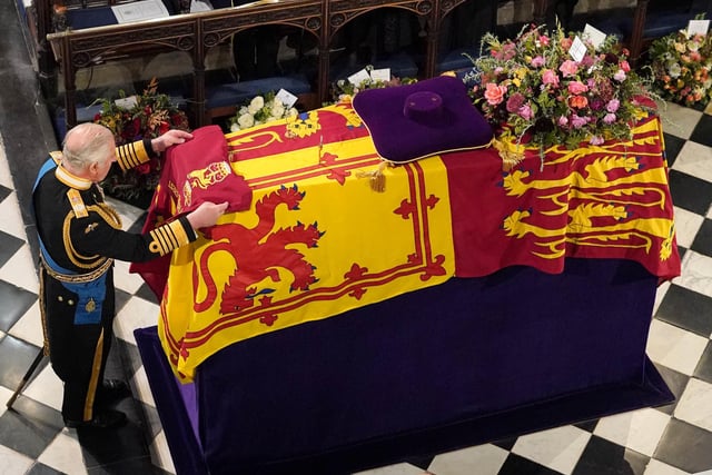 Jonathan Brady was at Windsor Castle in Berkshire to capture the historic moment the King placed the Company Camp Colour of the Grenadier Guards on his late mother’s coffin.

Jonathan said: “This and one other image were the most poignant images I made during the funeral service for the late Queen held at St George’s Chapel, Windsor Castle.

“However, this image seemed to have the most resonance in terms of its use in the papers the following day.”