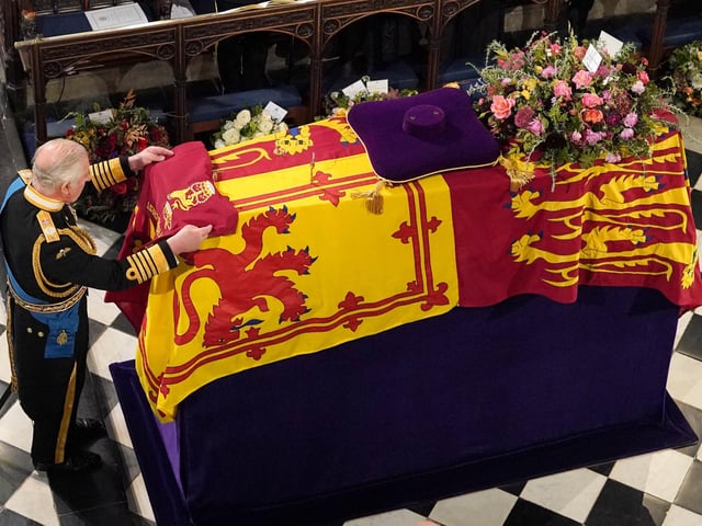 Jonathan Brady was at Windsor Castle in Berkshire to capture the historic moment the King placed the Company Camp Colour of the Grenadier Guards on his late mother’s coffin.
Jonathan said: “This and one other image were the most poignant images I made during the funeral service for the late Queen held at St George’s Chapel, Windsor Castle.
“However, this image seemed to have the most resonance in terms of its use in the papers the following day.”