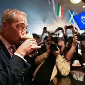 Reform leader Nigel Farage poses with a pint of beer in a Wetherspoons pub in Clacton-on-Sea (Picture: Ben Stansall/AFP via Getty Images)