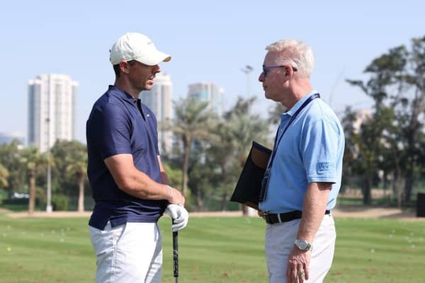 Rory McIlroy chats with DP World Tour chief executive Keith Pelley on the driving range prior to the Hero Dubai Desert Classic at Emirates Golf Club. Picture: Richard Heathcote/Getty Images.