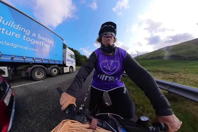 Lady Bathurst, 58, is narrowly missed by an overtaking car whilst cycling for charity. Picture: Tom Wakefield/Cotswold TV/SWNS
