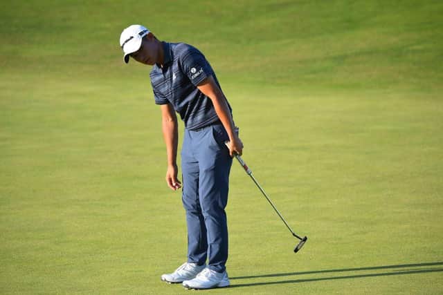 Collin Morikawa reacts after missing a put on the 16th green. Picture: Andy Buchanan/AFP via Getty Images.