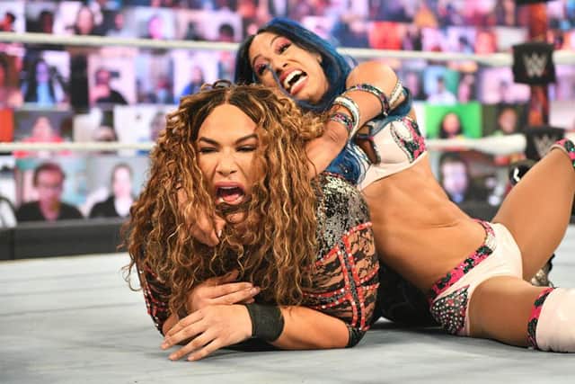 Sasha Banks locks a submission on to Nia Jax (Photo: WWE.com)