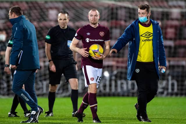 Craig Wighton holds the match ball following his treble for Hearts against Dundee.