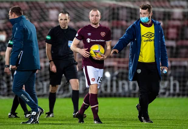 Craig Wighton holds the match ball following his treble for Hearts against Dundee.