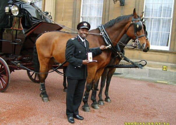 Wayne McCollin receiving his Queen’s Fire Service Medal in 2006 when he was Assistant Chief Officer at Lothian & Borders.