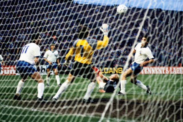 Scotland striker Mo Johnston (grounded) sees his spectacular effort go in against Cyprus