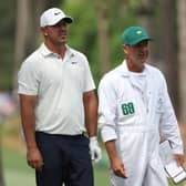 Brooks Koepka talks with his caddie Ricky Elliott on the 17th hole during the second round of the 2023 Masters at Augusta National Golf Club. Picture: Patrick Smith/Getty Images.