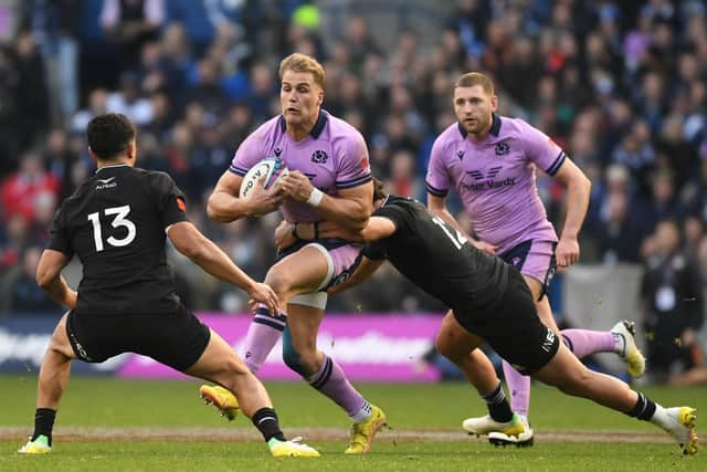 Scotland's Duhan Van Der Merwe is tackled by New Zealand's David Havili during the match at BT Murrayfield.