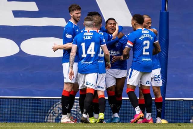 Rangers players celebrate with Alfredo Morelos after the striker had scored to put his team 2-1 up against Celtic at Ibrox. (Photo by Craig Williamson / SNS Group)