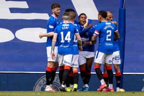 Rangers players celebrate with Alfredo Morelos after the striker had scored to put his team 2-1 up against Celtic at Ibrox. (Photo by Craig Williamson / SNS Group)