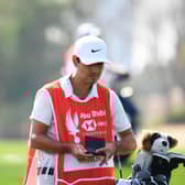 Rory McIlroy and caddie Harry Diamond look on during day one of the Abu Dhabi HSBC Championship at Abu Dhabi Golf Club. Picture: Ross Kinnaird/Getty Images.