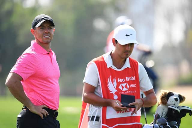 Rory McIlroy and caddie Harry Diamond look on during day one of the Abu Dhabi HSBC Championship at Abu Dhabi Golf Club. Picture: Ross Kinnaird/Getty Images.