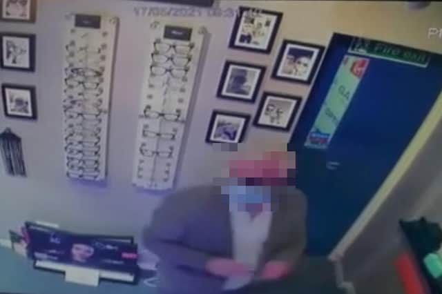 The suspected thief in an opticians.