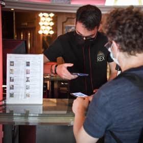 People wanting to go to cinemas, museums or sports matches in France have to prove they have had a Covid-19 vaccination or a recent negative test. Photo by ALAIN JOCARD/AFP via Getty Images