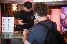 People wanting to go to cinemas, museums or sports matches in France have to prove they have had a Covid-19 vaccination or a recent negative test. Photo by ALAIN JOCARD/AFP via Getty Images