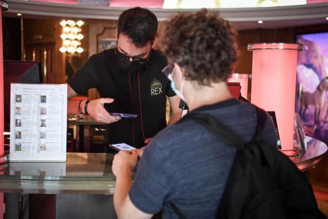 People wanting to go to cinemas, museums or sports matches in France have to prove they have had a Covid-19 vaccination or a recent negative test. Photo by ALAIN JOCARD/AFP via Getty Images