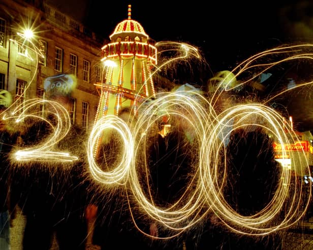 Youngsters "paint" the numbers 2000 with sparklers as Millennium Hogmanay celebrations get underway in Edinburgh.