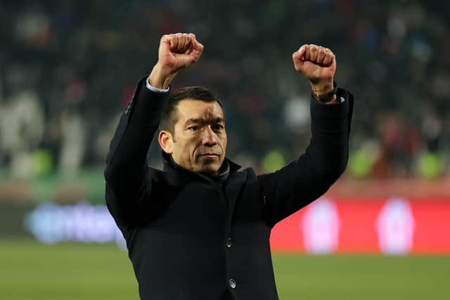 Rangers manager Giovanni van Bronckhorst takes the acclaim of the visiting fans in Belgrade after his team's 4-2 aggregate victory over Red Star to reach the Europa League quarter-finals. (Photo by Srdjan Stevanovic/Getty Images)